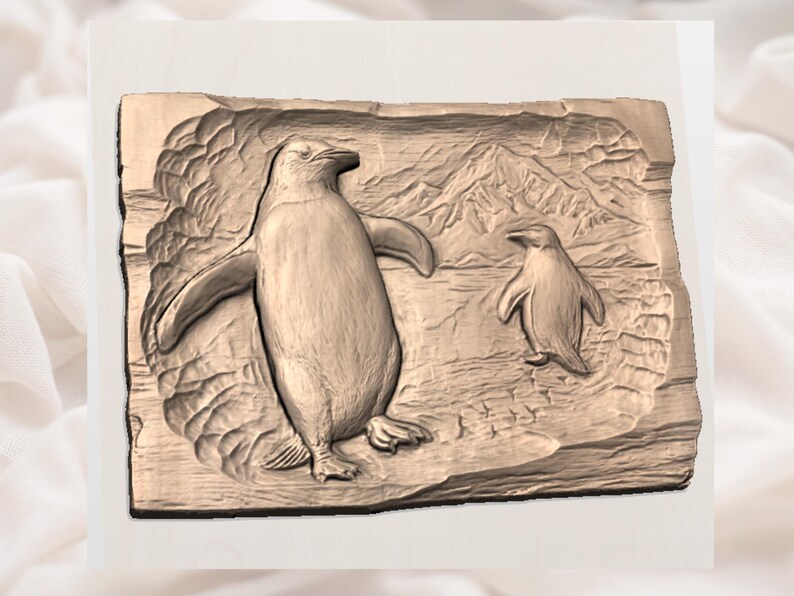 May include: A wooden relief carving of two penguins in a naturalistic setting. The larger penguin has outstretched wings, and a smaller penguin stands nearby. The background features a mountain range. The carving is in shades of brown.