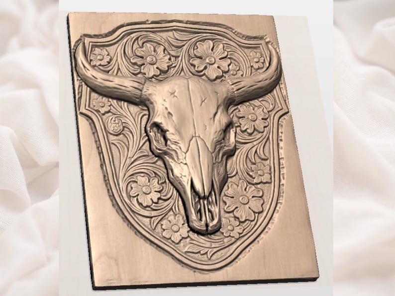 May include: A wooden wall art piece featuring a detailed carving of a bull skull with long horns. The skull is centered on a shield-shaped background, surrounded by floral patterns. The artwork is in a natural wood tone.