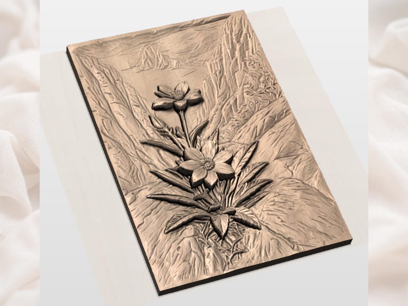 May include: A rectangular, bronze-colored relief carving featuring a detailed floral design. The carving depicts two flowers with multiple petals, surrounded by leaves, set against a mountainous backdrop. The artwork is presented on a rectangular wooden base.