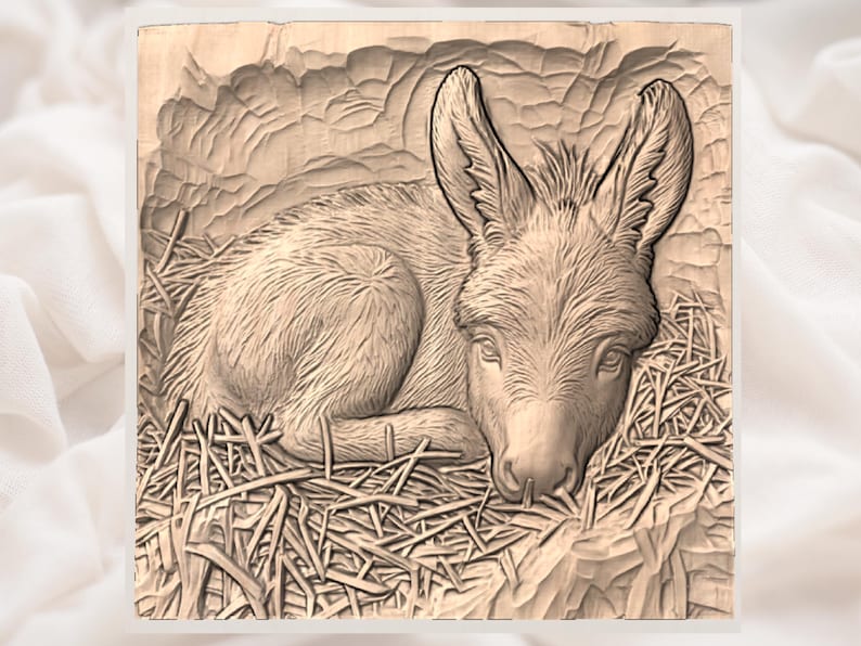 May include: A wooden carving of a donkey lying in straw. The donkey has large ears and is resting its head on the straw. The carving is detailed, with visible texture and shading, and is set against a neutral background.
