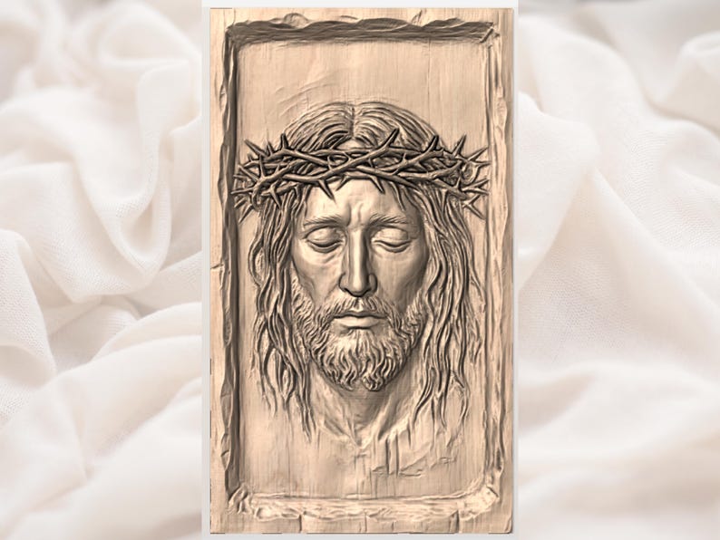 May include: A detailed wooden carving of a man with long hair, a beard, and a crown of thorns. The carving is set within a rectangular frame. The man's eyes are closed, and the overall tone is one of serenity.