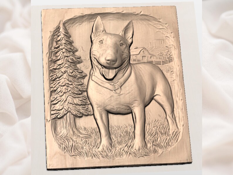 May include: A wooden relief carving of a Bull Terrier dog standing in a grassy field. The dog is smiling with its tongue out. A pine tree and a house with a fence are in the background. The carving is in a rectangular frame.