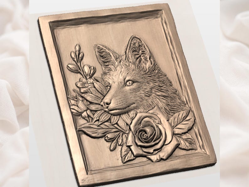 May include: A rectangular, bronze-colored relief carving featuring a fox's head surrounded by roses and foliage. The fox is depicted in profile, with detailed fur and facial features. The floral elements include a large rose and other blossoms.