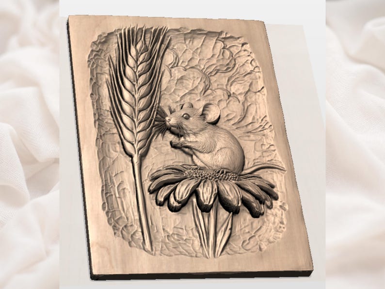 May include: A wooden relief carving of a mouse perched on a flower, with a tall stalk of wheat to the left. The carving is in shades of brown and beige, with detailed textures. The mouse appears to be eating the flower.
