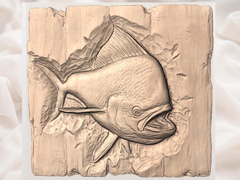 May include: A detailed wood carving of a fish with an open mouth, set against a textured background. The fish is carved in a light brown color, with visible scales and fins. The carving is mounted on a rectangular wooden plaque.
