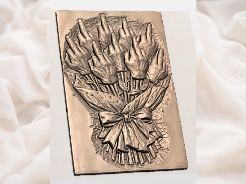 May include: A bronze-colored relief sculpture of a bouquet of hands, each displaying the middle finger. The hands are arranged like flowers, tied with a ribbon and wrapped in decorative paper. The artwork is mounted on a rectangular plaque.
