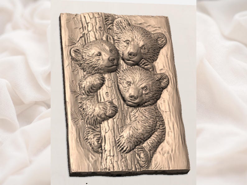 May include: A bronze relief carving of three bear cubs on a tree trunk. The cubs are detailed, with textured fur and facial features. The relief is rectangular and has a bronze colour, with the cubs appearing to be looking out.