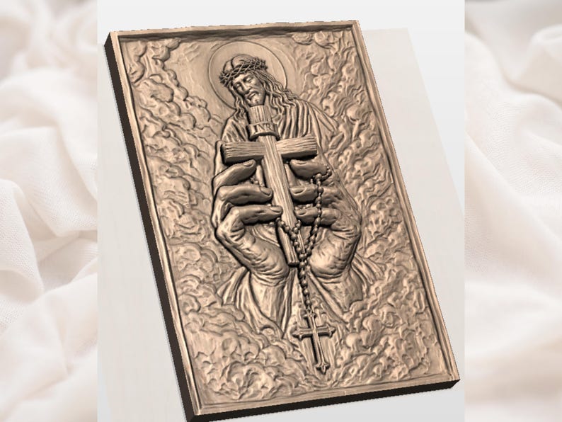 May include: A bronze-coloured relief carving of a religious figure holding a cross and rosary beads. The figure has a halo and a crown of thorns, set against stylized clouds. The rectangular carving is framed.