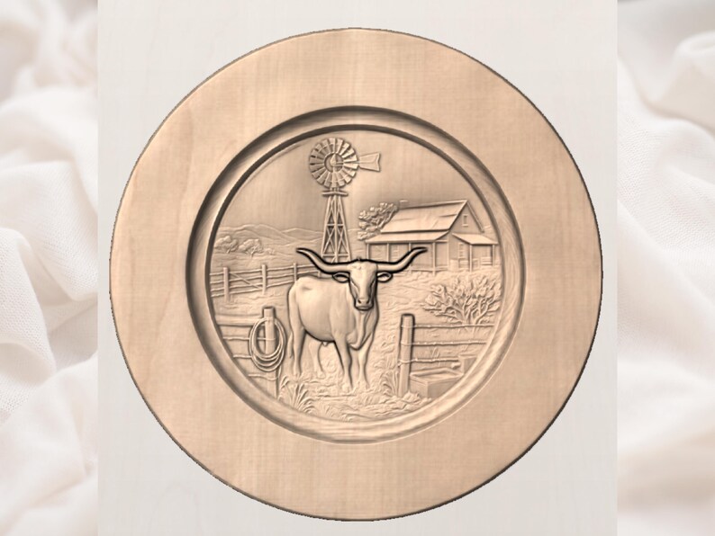 May include: A circular, wooden decorative plate featuring a carved relief of a longhorn steer in a rural setting. The design includes a windmill, a farmhouse, and a fence. The plate is light brown in colour.