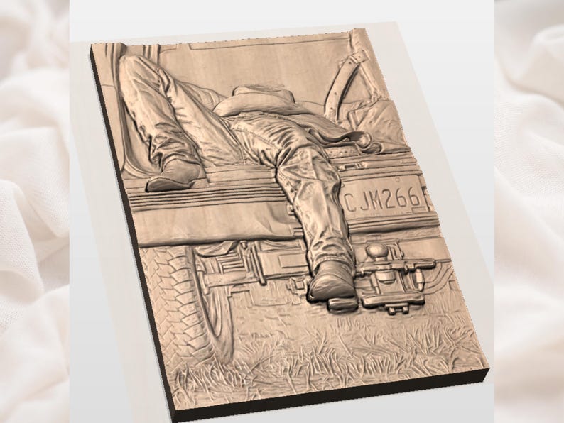 May include: A wooden relief carving depicting a person resting on the tailgate of a truck. The carving shows the person's legs, boots, and a cowboy hat. The truck's license plate reads CJM266. The carving is in shades of brown.