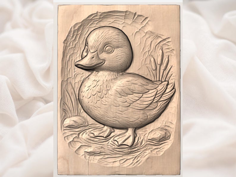 May include: A carved wooden plaque featuring a detailed relief of a duckling. The duckling is depicted with textured feathers, a rounded body, and a detailed beak. The background includes carved reeds and a water-like texture, all in natural wood tones.