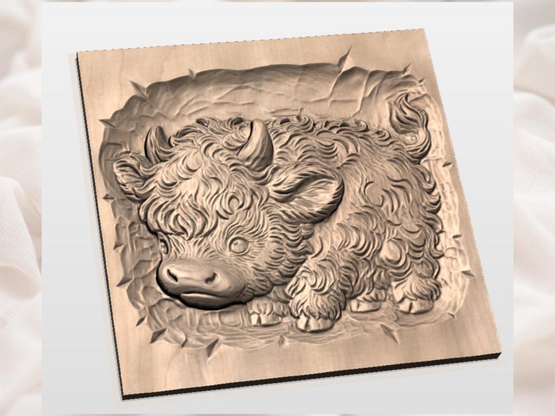 May include: A wooden carving of a Highland cow in a square frame. The cow is depicted with detailed fur, horns, and a gentle expression. The carving is in shades of brown and tan, with a textured appearance.