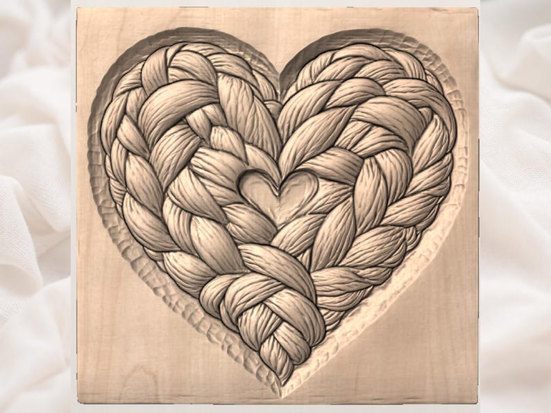 May include: A wooden carving of a heart shape, intricately carved with a woven rope design. The heart is centered on a square wooden block, with a smaller heart carved within the larger one. The wood has a natural, light brown color.