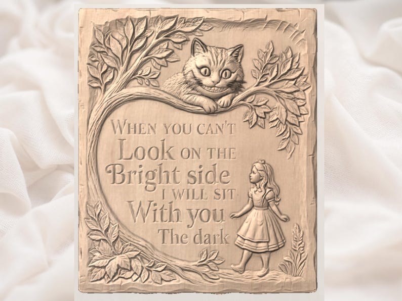 May include: A rectangular, light brown plaque with a carved design featuring the Cheshire Cat, Alice, and text from Alice in Wonderland. The text reads, "When you can't look on the bright side, I will sit with you in the dark."