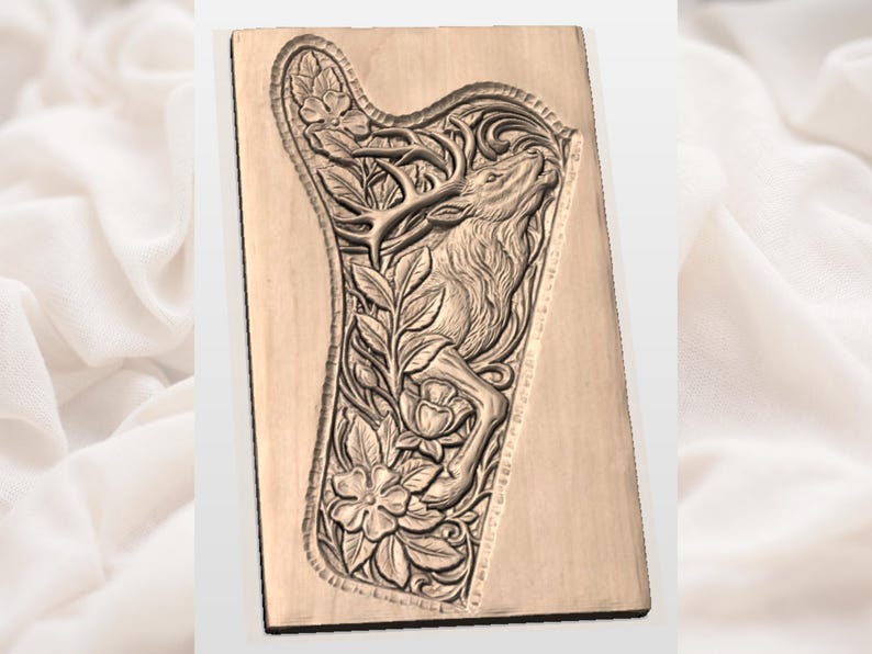 May include: A light brown wooden plaque with a detailed relief carving of a harp. The harp design incorporates a deer, flowers, and foliage. The carving is set against a rectangular background.
