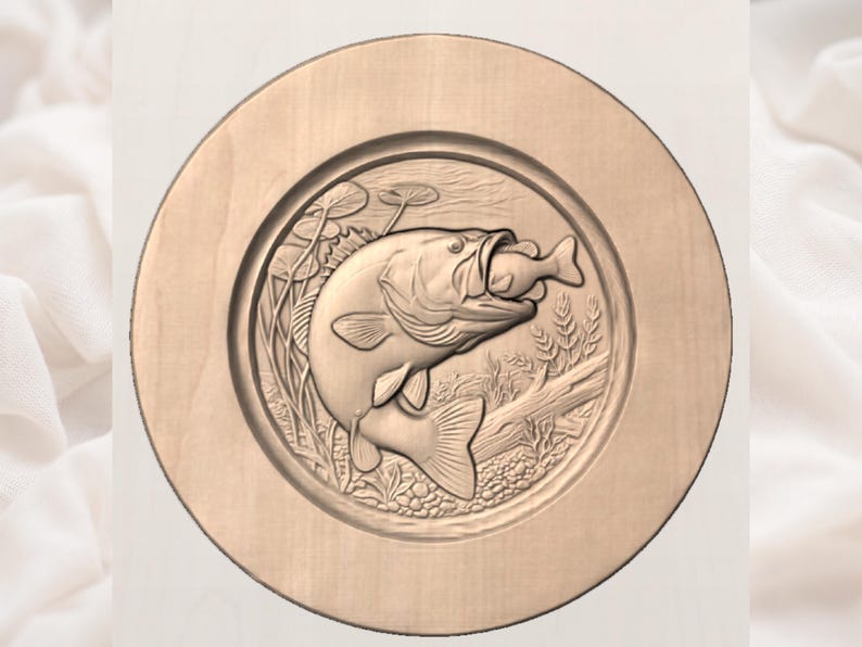 May include: A round, wooden plaque featuring a detailed relief carving of a largemouth bass with a smaller fish in its mouth. The design includes aquatic plants and a log, all within a circular frame.