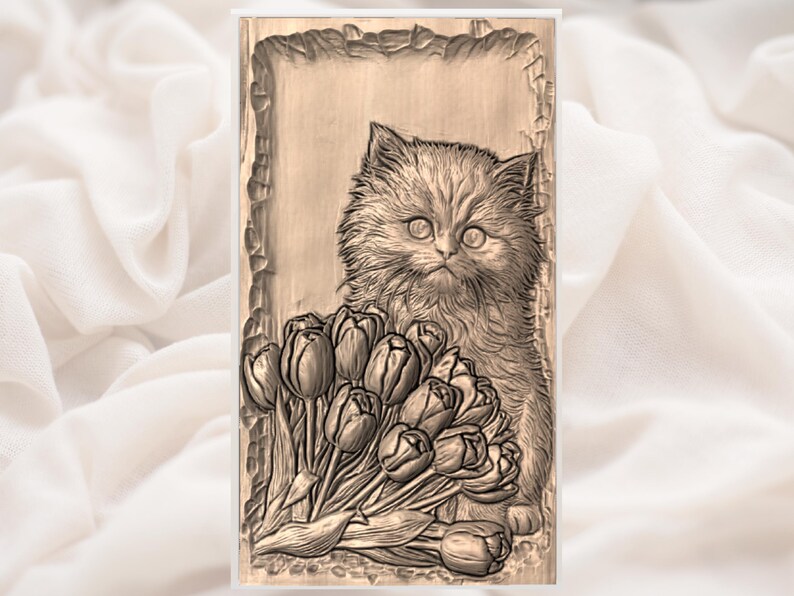 May include: A detailed wood carving of a fluffy kitten with large eyes, positioned next to a bouquet of tulips. The carving is in a rectangular frame with a textured border, showcasing the cat and flowers in a naturalistic style.
