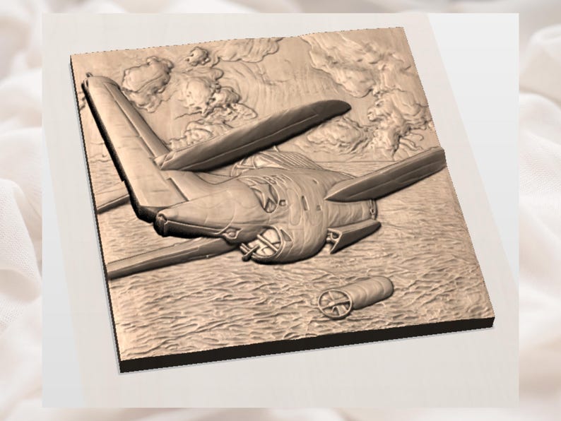 May include: A sepia-toned relief carving of an aircraft in flight. The artwork shows the plane with its wings and propeller, set against a backdrop of clouds and a textured landscape. A cylindrical object is also present.