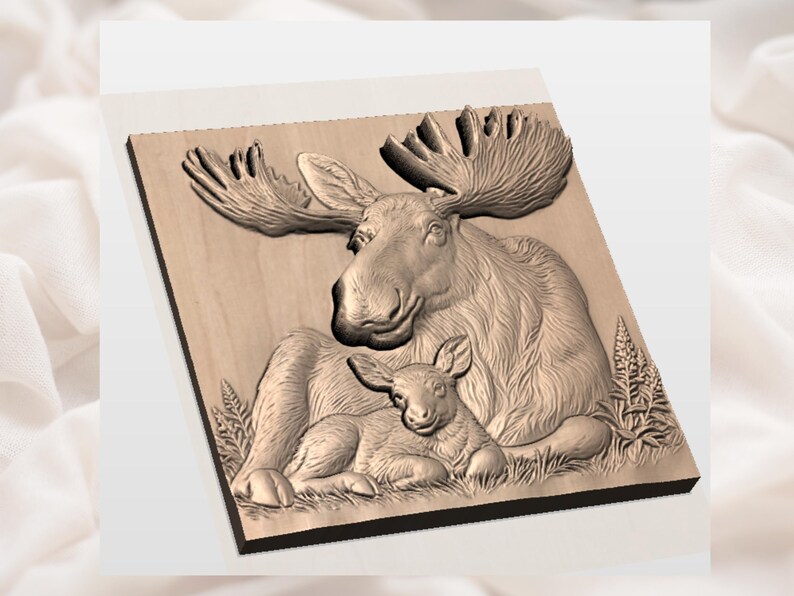 May include: A wooden relief carving of a moose and calf. The adult moose has large antlers and is seated, with the calf lying down beside it. The carving is detailed and shows the texture of the moose's fur and the surrounding foliage.