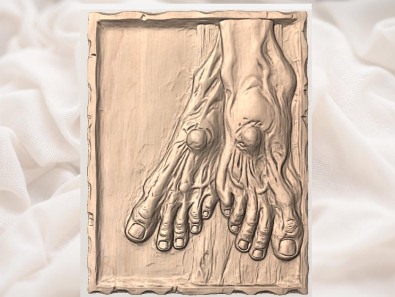 May include: A detailed, light brown relief carving of two feet. The carving shows the intricate details of the feet, including the toes, toenails, and veins. The feet are positioned side by side, with the toes pointing towards the viewer.