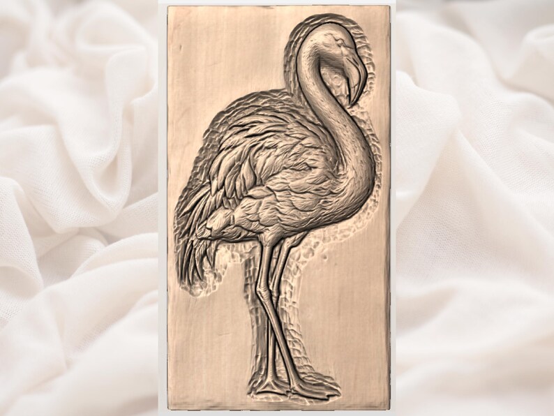 May include: A detailed relief carving of a flamingo in a rectangular frame. The flamingo is depicted in profile, with its head gracefully curved down. The carving is in shades of brown and tan, showcasing the bird's feathers and slender legs.