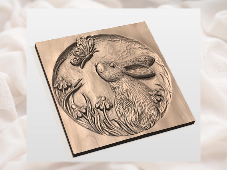 May include: A wooden relief carving of a rabbit gazing at a butterfly. The artwork features a circular scene with detailed depictions of flowers and foliage. The relief is mounted on a square wooden base.