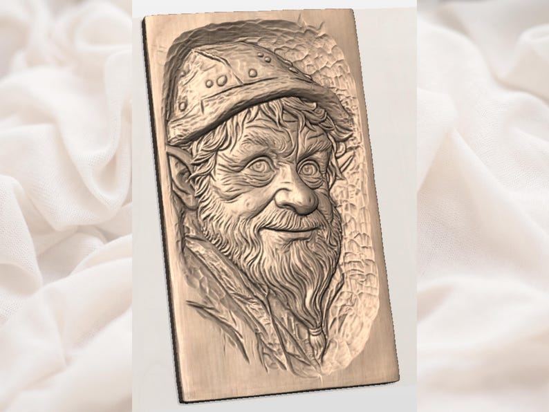 May include: A rectangular, bronze-colored relief carving of a bearded man wearing a hat. The man has a long beard and a detailed facial expression. The carving is set against a textured background.