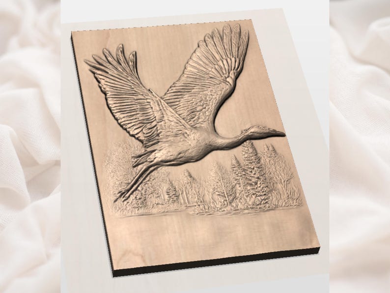 May include: A wooden relief carving of a crane in flight over a forest and water. The crane is depicted with outstretched wings, showcasing detailed feather textures. The artwork is mounted on a rectangular wooden panel.