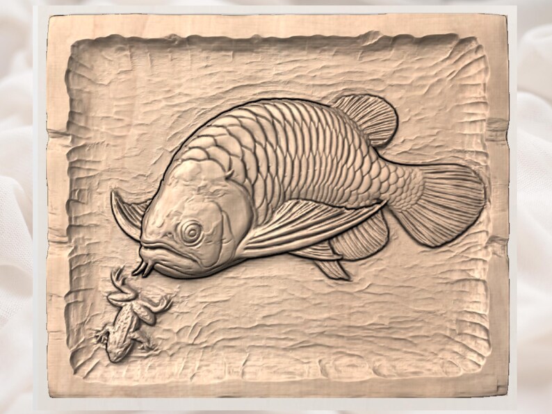 May include: A detailed wood carving of a large fish facing a small frog. The fish has detailed scales and fins, and the frog is small with detailed legs. The carving is set in a rectangular frame with a textured background.