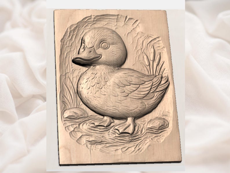 May include: A wooden relief carving of a duckling in a pond setting. The duckling is detailed with feathers and a beak, surrounded by reeds and water elements. The carving is on a rectangular wooden plaque.