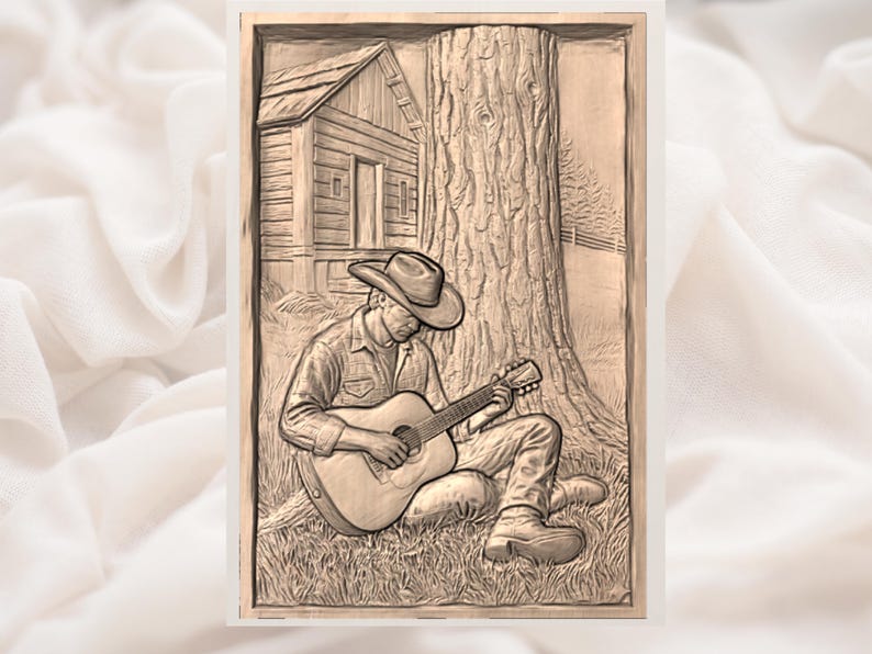 May include: A sepia-toned relief carving shows a person in a cowboy hat playing a guitar, seated against a large tree. A small cabin is visible in the background. The artwork is framed and set against a soft, white background.