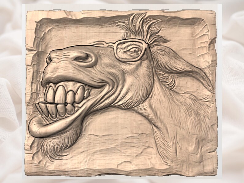 May include: A carved wooden relief depicting a smiling donkey wearing glasses. The donkey's teeth are visible, and its fur is textured. The relief is in a rectangular shape with a light brown color.