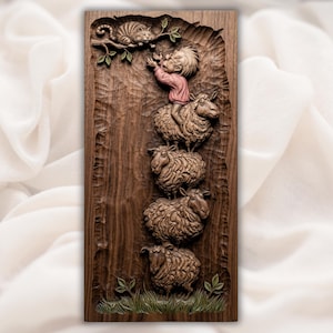 May include: A carved wooden wall art piece depicting a whimsical scene. A figure in a pink shirt reaches for a cat in a tree, atop a stack of four sheep. The artwork is in shades of brown and green, with detailed carving.