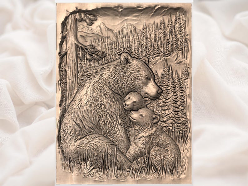 May include: A detailed wood carving depicts a bear with two cubs in a forest setting. The mother bear embraces her cubs, with a backdrop of trees, mountains, and a tree trunk. The artwork is in shades of brown and beige.
