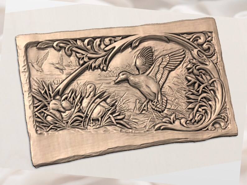 May include: A rectangular, light brown relief carving depicting ducks in a marsh setting. The detailed artwork shows ducks in flight and resting among reeds, with decorative floral elements framing the scene.
