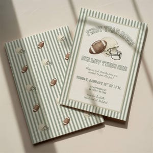 May include: Football-themed invitation with a watercolor illustration of a football and helmet. The invitation features the text "First Year Down, Our MVP Turns One!" on a striped background. The date and time are also included.