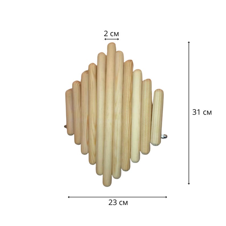 May include: A natural wood wall decor piece. The diamond-shaped design is constructed from numerous cylindrical wooden dowels. The piece measures 23 cm wide, 31 cm high, and 2 cm thick. The light-colored wood has a smooth finish.