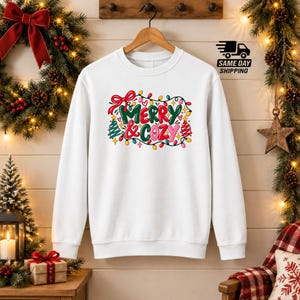 Merry and Cozy Sweatshirt, Christmas Lights Lettering Crewneck, Doodle Bow and Star Xmas Pullover, Hygge Holiday Top, Snuggle Season Outfits