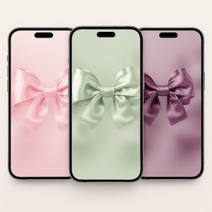 May include: Three smartphones displaying bow-themed wallpapers. The screens feature a pink, green, and purple bow against a matching background. The bows have a satin-like texture, adding a touch of elegance to the digital design.