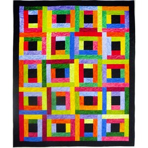 May include: A quilt featuring a log cabin block pattern with a central black square in each block, surrounded by strips of red, orange, yellow, green, blue, and purple fabric. The entire quilt is framed by a solid black border.
