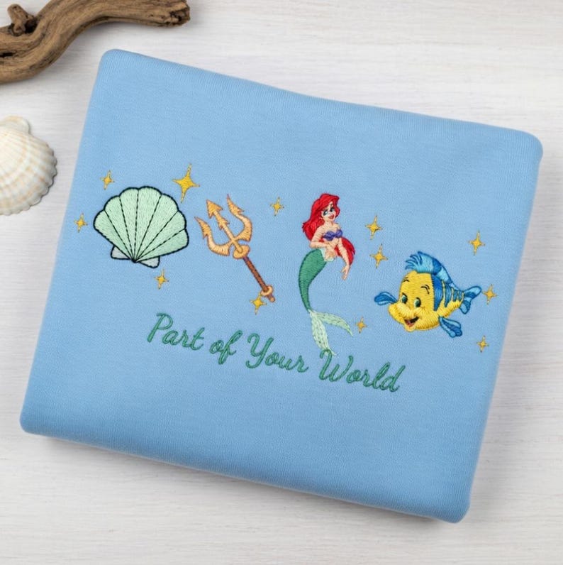 May include: A set of three ceramic mugs with a speckled, matte finish. The mugs are in shades of cream, light gray, and dark gray. Each mug has a simple, minimalist design and a rounded handle. The mugs are stacked on top of each other.