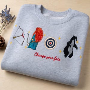 May include: A white ceramic mug with a black handle and the text "But First, Coffee" in a handwritten style. The mug is on a white surface. The mug is approximately 4 inches tall.