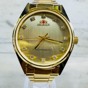 オリエンテックス ゴールドトーン メンズ腕時計 耐磁性ダイヤモンドマーカー 新品