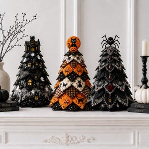 May include: Three decorative Halloween-themed cone-shaped trees. The left tree features a black haunted house with glowing windows. The center tree is made of orange and black quilted fabric with cat and pumpkin motifs. The right tree has a black spider topper.