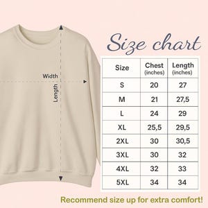 May include: A beige sweatshirt with a crew neck, next to a size chart. The chart lists sizes S to 5XL, with chest measurements from 20 to 34 inches and lengths from 27 to 34 inches. The text "Recommend size up for extra comfort!" is at the bottom.