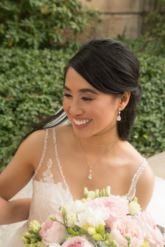 white wedding dress with rose gold jewelry Ivory and Co Balmoral Rose Gold Wedding Jewelry Set