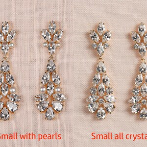 May include: Two pairs of gold dangle earrings with crystal and pearl accents. The earrings on the left have pearls, while the earrings on the right are all crystal. The earrings are labeled "Small with pearls" and "Small all crystal".