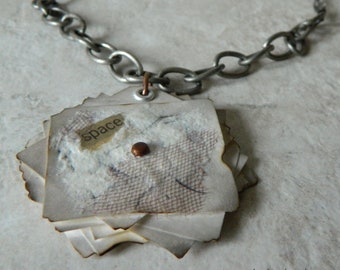Recycled paper and objects mixed media pendant