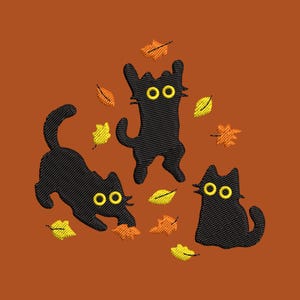 May include: An embroidered design featuring three black cats with yellow eyes playing among falling autumn leaves in shades of yellow, orange, and brown. The background is a solid burnt orange color.