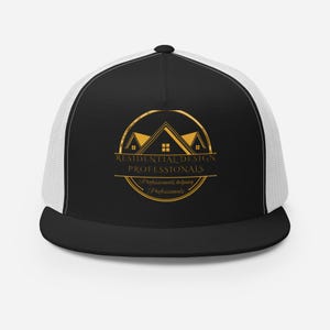 May include: Black and white trucker hat with a curved brim. The front panel features a gold logo with the text "RESIDENTIAL DESIGN PROFESSIONALS" and "Professionals helping Professionals" in a circular design.
